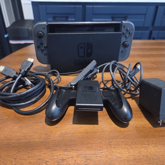 Used Nintendo Switch Console- Includes Joycon, Grip, USB Cord